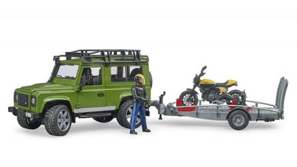 Land Rover Defender met aanhanger en Ducati Scrambler