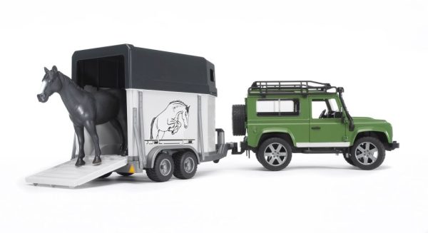 Land Rover Defender met paardentrailer en paard